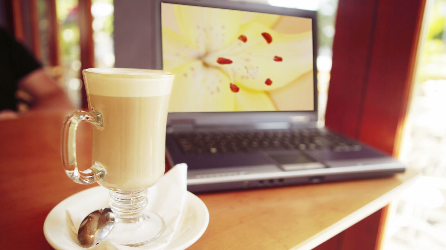 Computer with cup of coffee